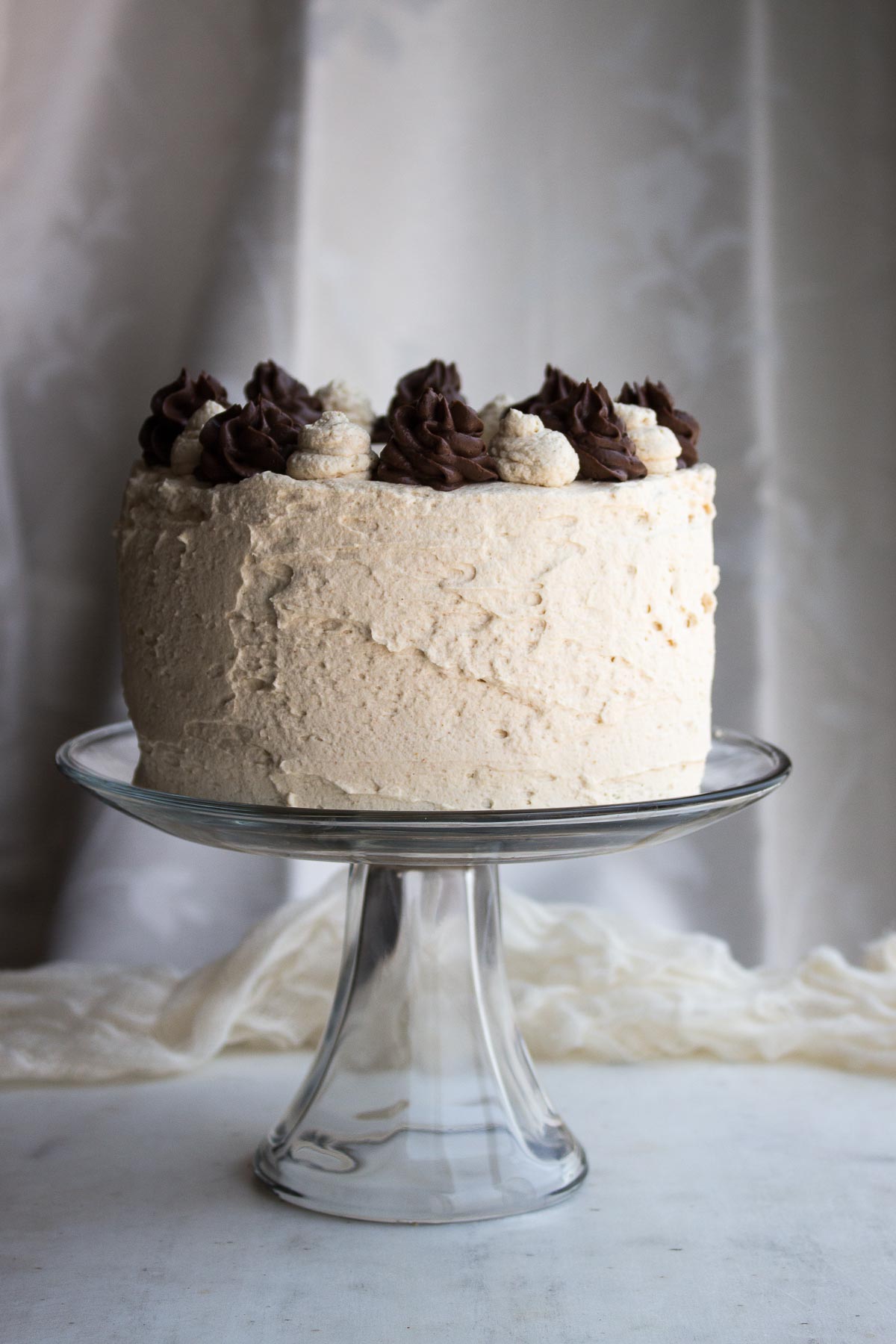 Super moist low carb peanut butter chocolate cake, filled with rich chocolate pastry cream & frosted with peanut butter whipped cream. low carb, gluten-free, keto, thm-h