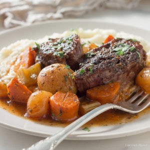 Low carb pot roast with vegetables in gravy served on cauliflower mash. keto, LCHF