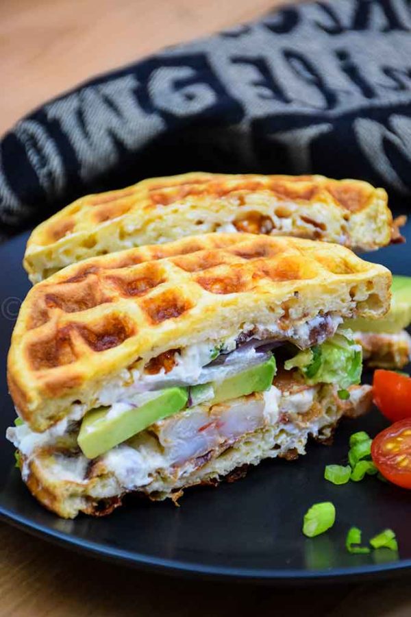 Cajun Shrimp and Avocado Chaffle cut in half to show inside of sandwich