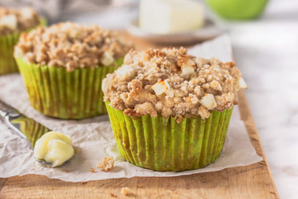 keto apple spice muffins with streusel topping on cutting board